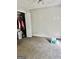 Neutral-colored bedroom with neutral carpeting and a walk-in closet at 149 Wimberly Way, Powder Springs, GA 30127