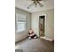 Cozy bedroom with neutral carpeting and a window, next to an ensuite bathroom at 149 Wimberly Way, Powder Springs, GA 30127