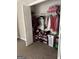 Well-organized walk-in closet with shelves, hanging rods, and a laundry basket at 149 Wimberly Way, Powder Springs, GA 30127