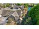 Aerial view of a townhome showcasing private patios, mature landscaping, and serene views, with pond access at 406 Kenley Ct, Mcdonough, GA 30253