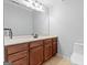 Bathroom featuring wood cabinets, spacious vanity and sink, with a ceramic tile floor at 406 Kenley Ct, Mcdonough, GA 30253