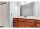 Neutral bath featuring wood cabinets, spacious vanity and sink, with a ceramic tile floor at 406 Kenley Ct, Mcdonough, GA 30253