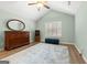 Bright bedroom featuring vaulted ceilings, shuttered windows, and wood-look flooring at 406 Kenley Ct, Mcdonough, GA 30253