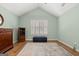 Bedroom with an area rug, vaulted ceilings, and a built-in shelving unit at 406 Kenley Ct, Mcdonough, GA 30253