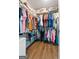 Walk-in closet with built-in shelving and ample storage space at 406 Kenley Ct, Mcdonough, GA 30253