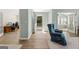 Bright foyer with wood floors, leading to a living room, with views of the front lawn and office at 406 Kenley Ct, Mcdonough, GA 30253
