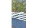 This is a photograph of a dark deck being freshly painted at 3870 Michaels Creek Ct, Loganville, GA 30052