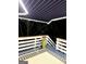 View of deck with retractable awning, outdoor furniture, and decorative rug at night at 3870 Michaels Creek Ct, Loganville, GA 30052