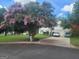 Beautiful home with flowering trees, a well-kept lawn, and a two-car garage, offering great curb appeal at 3870 Michaels Creek Ct, Loganville, GA 30052