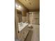 Bathroom features decorative wallpaper, a white vanity, and a tub-shower combo at 103 Belair Ln, Stockbridge, GA 30281