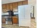 Kitchen showcasing stainless steel oven and refrigerator with wood cabinets at 103 Belair Ln, Stockbridge, GA 30281