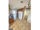 Traditional kitchen features wood cabinets, white appliances, and tile flooring at 103 Belair Ln, Stockbridge, GA 30281