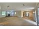 Open living room with a brick fireplace, light walls, and large windows that let in natural light at 103 Belair Ln, Stockbridge, GA 30281