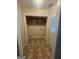 Entryway featuring tile flooring and dark wood cabinetry above the door at 103 Belair Ln, Stockbridge, GA 30281
