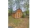 Wooden storage building with double doors and ample storage space at 103 Belair Ln, Stockbridge, GA 30281