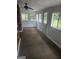 Sunroom featuring white wainscoting and multiple windows that brighten the room at 103 Belair Ln, Stockbridge, GA 30281