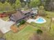 Aerial view of estate with pool, lush landscaping, and large well maintained yard at 3588 Sw Highridge Dr, Conyers, GA 30094