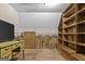 Attic space featuring a desk, TV, and custom-built bookshelves at 3588 Sw Highridge Dr, Conyers, GA 30094
