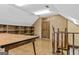 Attic with paneled walls, shelving and hardwood floors at 3588 Sw Highridge Dr, Conyers, GA 30094