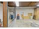 Unfinished basement space features concrete floors and exposed ceiling with plumbing at 3588 Sw Highridge Dr, Conyers, GA 30094