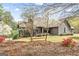 Charming home with a screened porch and lush landscaping at 3588 Sw Highridge Dr, Conyers, GA 30094