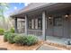Cozy front porch with rocking chairs and classic details at 3588 Sw Highridge Dr, Conyers, GA 30094