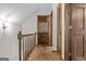 Hallway with hardwood floors, natural light, and access to the rooms at 3588 Sw Highridge Dr, Conyers, GA 30094
