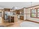 Spacious kitchen with stainless steel appliances, wood cabinets, and a center island at 3588 Sw Highridge Dr, Conyers, GA 30094
