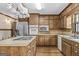 Renovated kitchen with stainless steel appliances, wood cabinets, and kitchen island at 3588 Sw Highridge Dr, Conyers, GA 30094