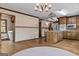 Bright eat-in kitchen featuring a kitchen island, wood cabinets, and stainless steel refrigerator at 3588 Sw Highridge Dr, Conyers, GA 30094