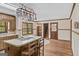 Eat-in kitchen shows island cooktop and eat in area, and wooden cabinets at 3588 Sw Highridge Dr, Conyers, GA 30094