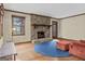 Spacious living room featuring a stone fireplace and ample natural light at 3588 Sw Highridge Dr, Conyers, GA 30094