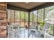 Relaxing screened porch with outdoor seating and views of the yard at 3588 Sw Highridge Dr, Conyers, GA 30094