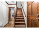 Classic wooden staircase and hardwood floors leads to the upper level of the house at 3588 Sw Highridge Dr, Conyers, GA 30094