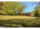 Expansive backyard with lush lawn and mature trees, providing ample space for outdoor activities and relaxation at 5183 Jones Ct, Morrow, GA 30260