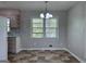 Cozy dining area with natural light, eat-in nook, and stylish vinyl flooring at 5183 Jones Ct, Morrow, GA 30260