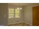 Dining room with window, ceiling light, hard surface floors and gray walls at 5183 Jones Ct, Morrow, GA 30260