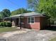 Charming single-story brick home with a well-maintained lawn and mature landscaping at 5183 Jones Ct, Morrow, GA 30260