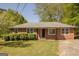 Charming single-story brick home with a well-maintained lawn and mature landscaping at 5183 Jones Ct, Morrow, GA 30260