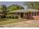 Charming single-story brick home with a well-maintained lawn and mature landscaping at 5183 Jones Ct, Morrow, GA 30260