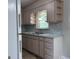 Bright kitchen features updated countertops, appliances, ample storage, and a window at 5183 Jones Ct, Morrow, GA 30260