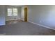Inviting living room featuring a large window with natural light and neutral paint at 5183 Jones Ct, Morrow, GA 30260