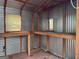 Shed interior featuring shelving and workbench, perfect for storage or hobbies at 5183 Jones Ct, Morrow, GA 30260