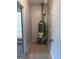 Utility room featuring water heater, tile flooring, and washer hookups at 5183 Jones Ct, Morrow, GA 30260