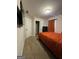 Bedroom with carpet flooring, a bed, and access to a bathroom and closet at 935 S Laney Rd, Locust Grove, GA 30248