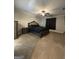 Spacious bedroom boasts a ceiling fan, a large bed, and matching furniture at 935 S Laney Rd, Locust Grove, GA 30248