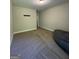 Empty bonus room with carpet flooring and neutral walls offers flexible living space at 935 S Laney Rd, Locust Grove, GA 30248