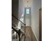 Bright entryway with hardwood floors, a high ceiling, and a staircase leading to the upper level at 935 S Laney Rd, Locust Grove, GA 30248