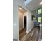 Bright hallway features hardwood floors, natural light, and access to multiple rooms at 935 S Laney Rd, Locust Grove, GA 30248