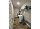 Practical laundry room features a washer, dryer, shelving, and ample space at 935 S Laney Rd, Locust Grove, GA 30248